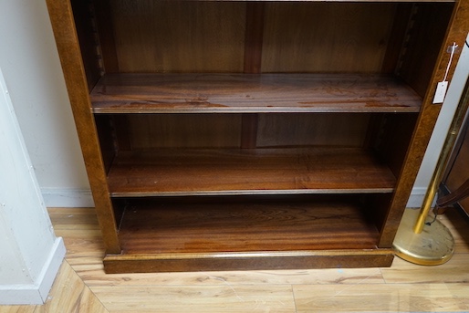 An Edwardian design bird's eye maple open bookcase, length 127cm, depth 32cm, height 193cm